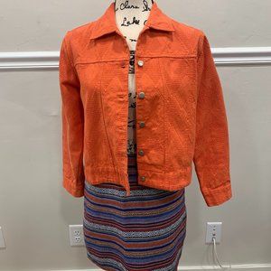 Orange blazer and striped miniskirt